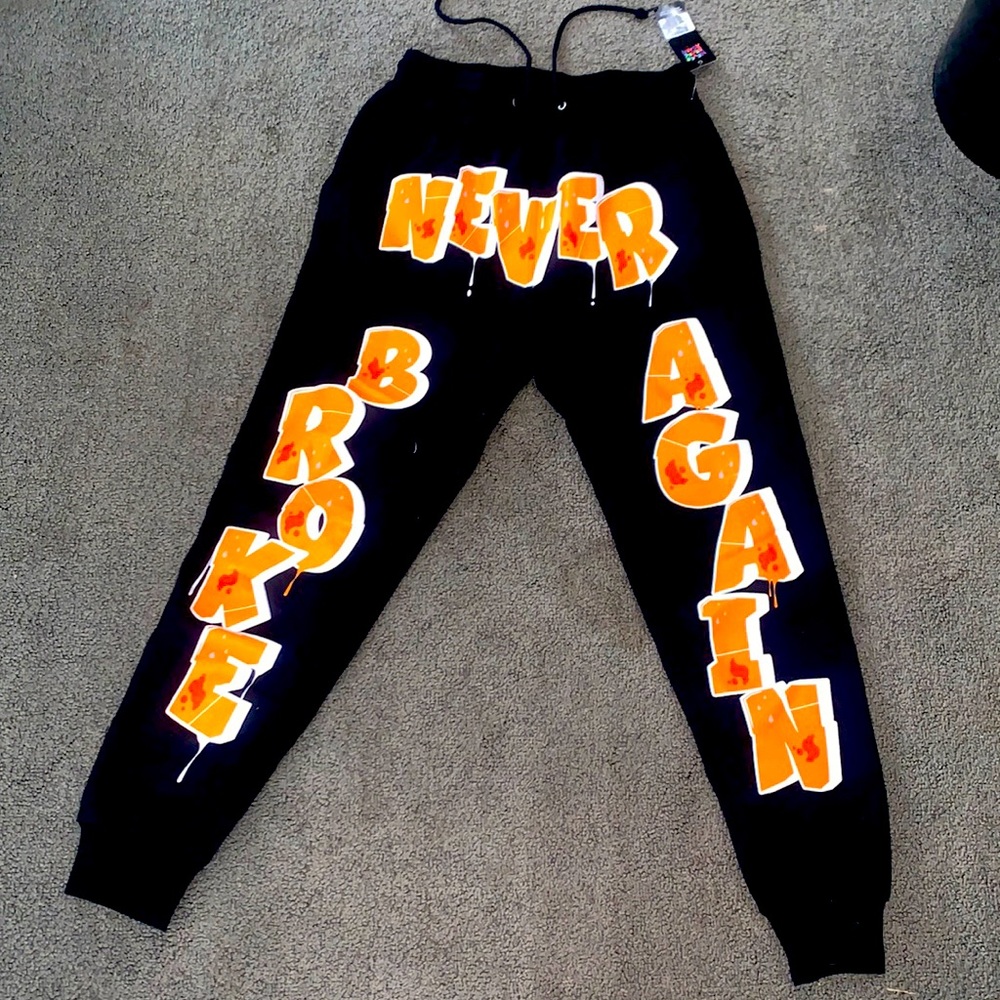 🔥BRAND NEW NEVER BROKE AGAIN ORANGE PRINT ALL-OVER SWEATPANTS🔥